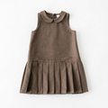 Front view of girls brown sleeveless pleated dress laid flat on white